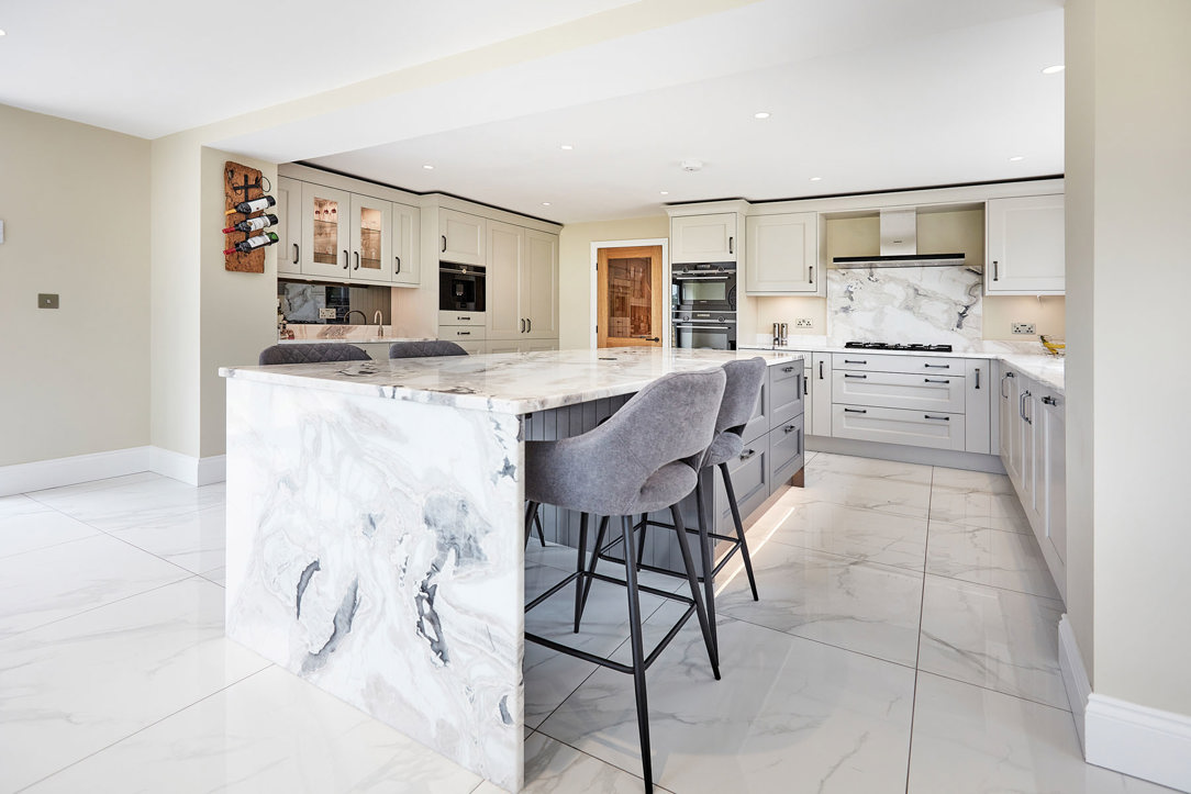 Grey and cream L shaped kitchen with island